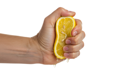 Hand squeezing a freshly cut lemon half, extracting juice while revealing seeds, set against a transparent background that highlights the vibrant yellow color and juicy texture