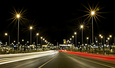 Night Cityscape: Illuminated Highway with Light Trails