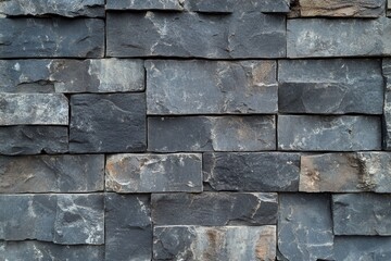 Naklejka premium A textured close up of stacked rectangular stone blocks