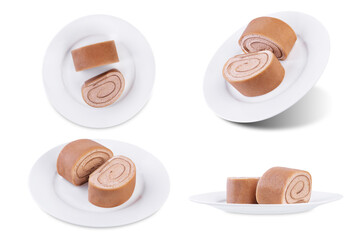 Chocolate crepe rolls with chocolate whipped cream filling in a plate on a white isolated background