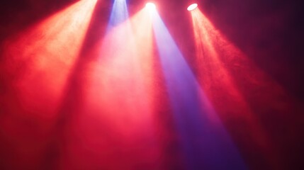 Bright stage spotlights shining vibrant red and blue light beams