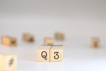Third quarter acronym. word Q3 written on wooden cubes isolated on white background with copy...