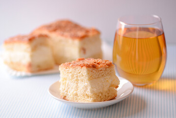 a close-up piece of delicious cake and juice on the table