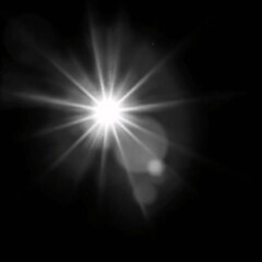 A radiant light source with prominent beams emanating from its central point in deep darkness.