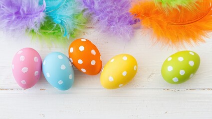 A collection of colorful Easter eggs with polka dots in hues of yellow, green, blue, and pink, sitting on a white surface.