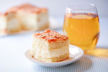 a close-up piece of delicious cake and juice on the table
