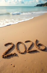 2026 written in the sand. The beach, the sea and the sun. Summer mood.
