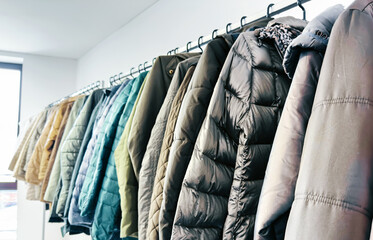 Clothing racks in second-hand store – sustainable fashion, vintage style, and conscious shopping