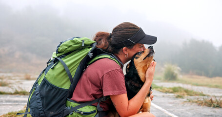 Woman, hug dog and outdoor for hiking in nature on trail, profile and care with bonding, rest and adventure. Person, embrace and pet animal with love, backpack and touch with connection in Argentina