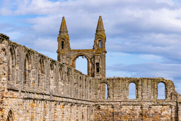 The ruins of St Andrews Cathedral overlook the sea, surrounded by ancient tombs and old stone...