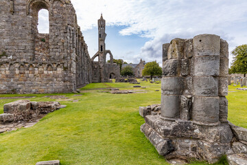 The ruins of St Andrews Cathedral overlook the sea, surrounded by ancient tombs and old stone...