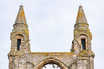 The ruins of St Andrews Cathedral overlook the sea, surrounded by ancient tombs and old stone...