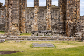 The ruins of St Andrews Cathedral overlook the sea, surrounded by ancient tombs and old stone...