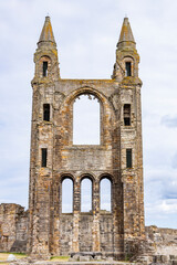 The ruins of St Andrews Cathedral overlook the sea, surrounded by ancient tombs and old stone...
