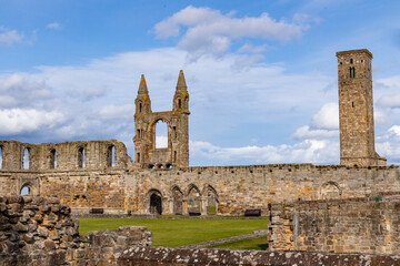 The ruins of St Andrews Cathedral overlook the sea, surrounded by ancient tombs and old stone...