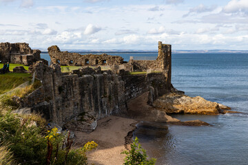 The ruins of St Andrews Cathedral overlook the sea, surrounded by ancient tombs and old stone...