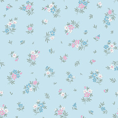 Cute floral pattern in small flowers. Small white, blue and pink flowers. Light blue background. Ditsy print. Floral seamless background. Ditsy template for fashion prints. Stock pattern.