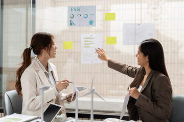 Environmental Strategy Planning. Professionals discussing ESG insights and sustainable initiatives in a collaborative environment.