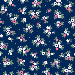 Cute Easter floral pattern. Pretty flowers on dark blue background. Printing with small white and pink flowers. Ditsy print. Seamless vector texture. Spring bouquet. Vintage template prints. 