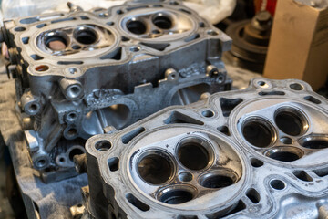 The cylinder valve and Cylinder head. Damaged cylinder head, worn valves, damaged engine