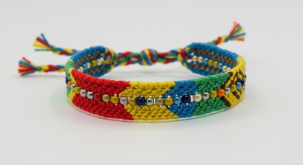 Handmade Woven Bracelet with Colorful Threads and Beads on White Background