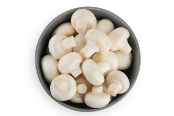 Fresh mushroom champignon in a ceramic bowl isolated on white background. Top view. Flat lay