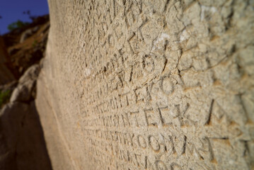 ancient greek inscription written on stone, nemrut mountain