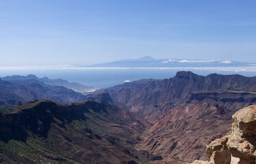 Gran Canaria, landscape of the central part of the island, Las Cumbres, ie The Summits, view from the foot of Roque Nublo towards Roque Bentayga, La Aldea de San Nicolas and Teide on Tenerife