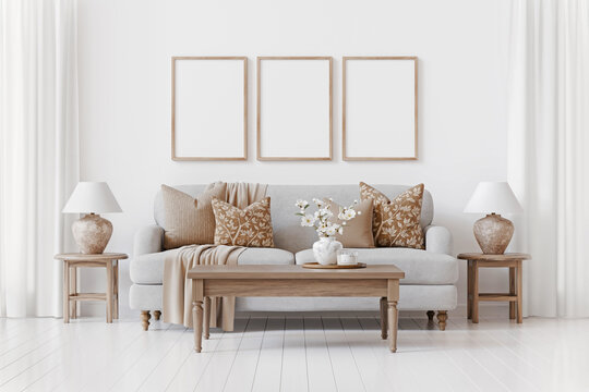 Nice traditional interior with three empty vertical frames on the wall above cozy sofa. Decorated white living room with curtains. 3d rendering.