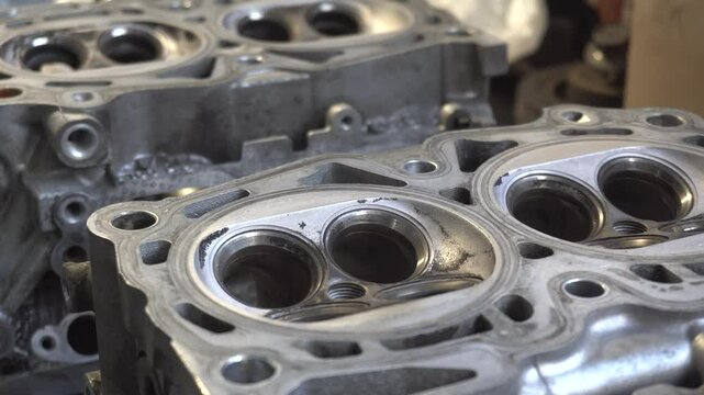 Car service. The cylinder valve and Cylinder head. Damaged cylinder head, worn valves, damaged engine