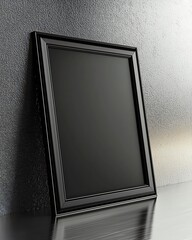 Elegant black 3D frame mock-up leaning slightly against a sleek metallic surface, ideal for professional text overlays