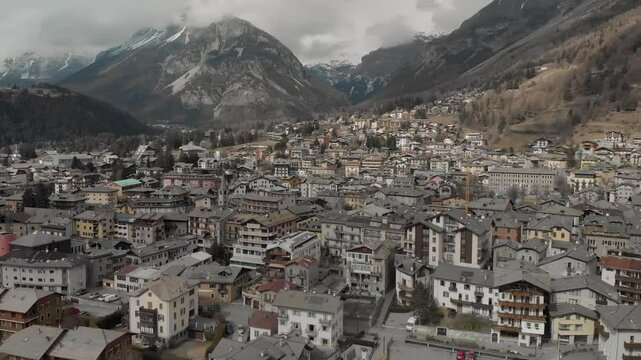 Panoramic drone view of the wonderful village of Bormio during a winter day. The location of Bormio is one of the venues of the next winter olympic games