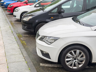 blue, red, black and white car sparked in a row, close-up