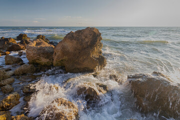 Waves run on stones on the seashore