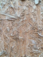 High-resolution seamless OSB (Oriented Strand Board) texture with visible wood flakes and natural fibers. Perfect for 3D environments, architectural renders, and material libraries