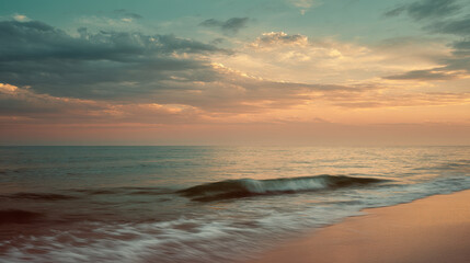 Obraz premium Seascape photograph during a calm evening, coral and turquoise sky meeting smooth ocean waves, dramatic cloud layers
