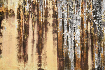 Cracked multicolor cement walls with stains from the weather. Old wall background texture,...