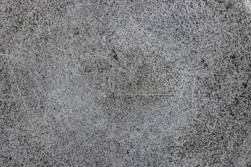 texture of flat cast iron surface with scratches and black stains