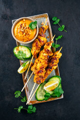 Sate Ayam- Grilled chicken satay sate skewers with peanut dipping spicy sauce, steamed rice and...