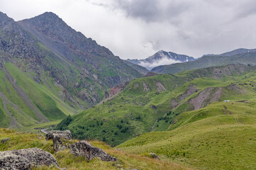 white small cloud in front of Caucasus mountain