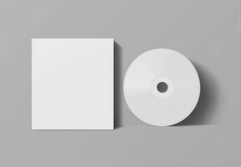White blank card and white CD or DVD on a grey background with s,Mockup
