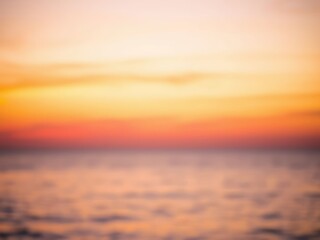 Captivating sunset over a tranquil ocean, showcasing soft pastel hues and gentle waves in a serene coastal setting