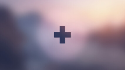 Obraz premium A Christian cross set against a sunrise or sunset sky with clouds.