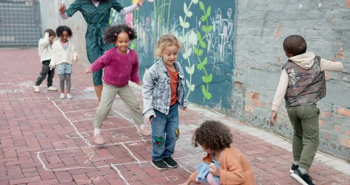 School, children and playing hopscotch outdoor with teacher for recess, learning break and fun activity. Montessori, people and playground game for gross motor skills, balance and agility development