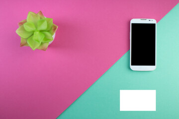 Business card blank over colorful background. Copy space for text. Top view.Business card blank over colorful abstract background. Corporate stationery branding mock-up. Copy space for text. Top view.