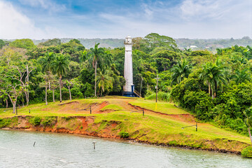A view towards a lighthouse beside the historic Gatun locks on the Panama Canal in Panama in...