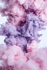 Abstract pastel ink swirling in water.