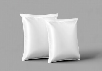 3D rendering of two white blank snack pillow bag mockups on a gr ,Mockup