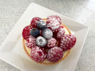 Close-up of a raspberry tart with vanilla cream, Biel, Bern canton, Switzerland