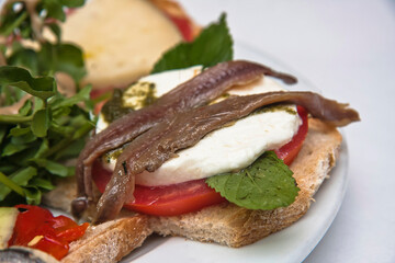 Traditional Spanish tapas, a variety of Spanish tapas served on a slice of baguette to share